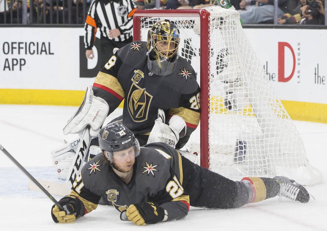 Golden Knights goaltender Marc-Andre Fleury (29) makes a save with the help of center Cody Eakin (21) in the second period during game four of Las Vegas' NHL Western Conference Finals matchup with ...
