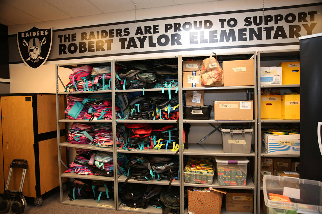 School supplies donated by the Raiders as part of the Communities In Schools of Southern Nevada program which promotes student success for all children, are displayed at Robert Taylor Elementary S ...