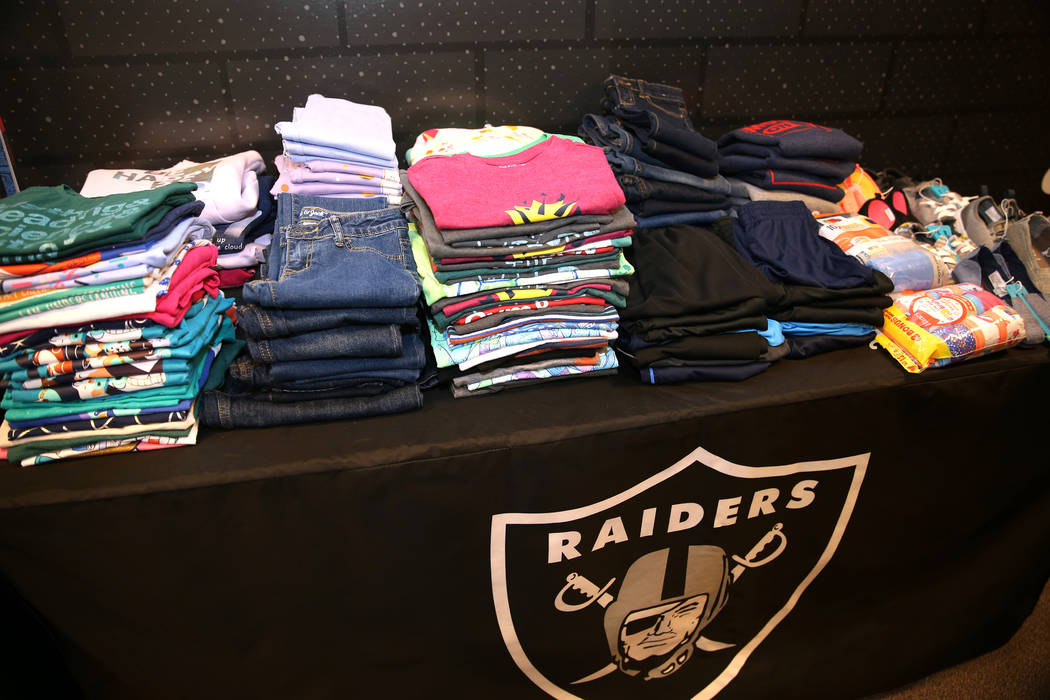 Clothes donated by the Raiders as part of the Communities In Schools of Southern Nevada program which promotes student success for all children, are displayed at Robert Taylor Elementary School in ...