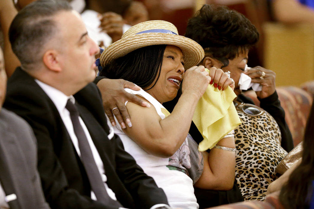 Trinita Farmer, center, mother of Tashii Brown, who died after an encounter with Las Vegas police in May 2017, sees an image of her son during a public review of evidence in the Clark County Commi ...
