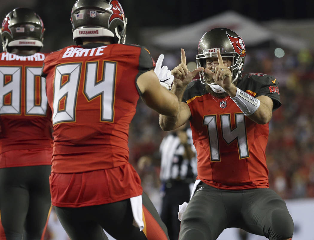 Tampa Bay Buccaneers quarterback Ryan Fitzpatrick (14) celebrates with  tight end Cameron Brate (84) after Brate caught a 4-yard touchdown pass  against the Pittsburgh Steelers during the first half …