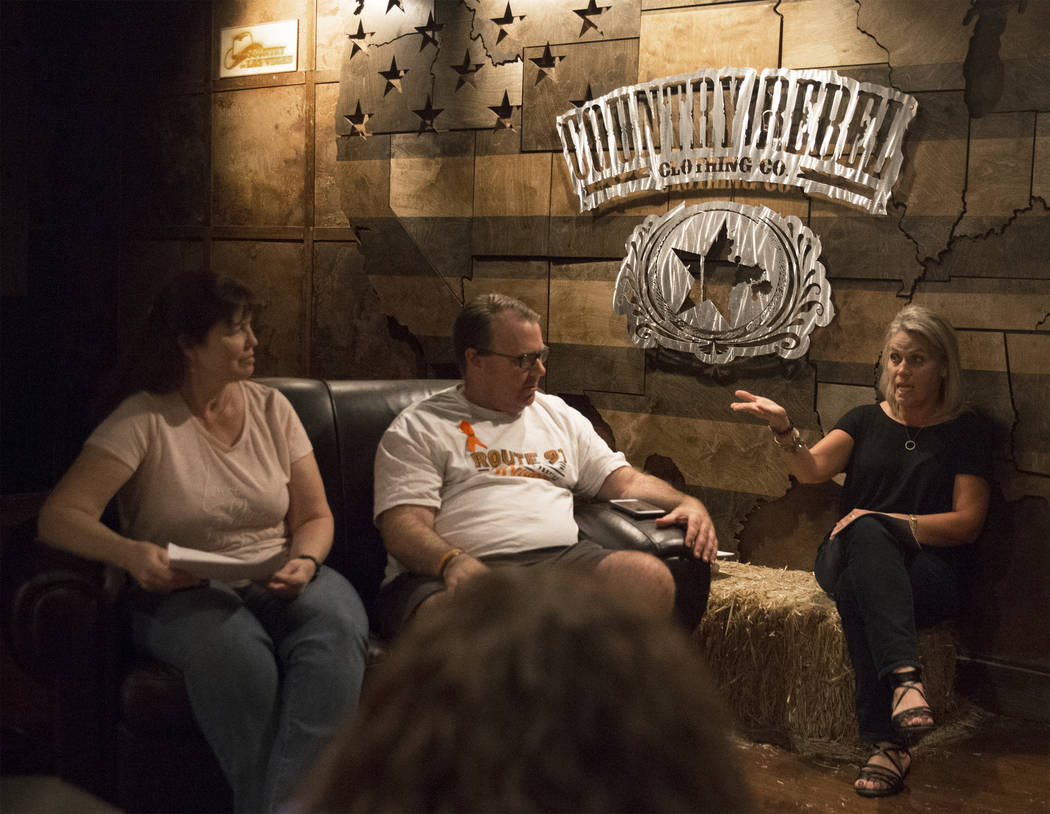 Deb Dailey, left, president of the EMS Training Center of Southern Nevada, Chris Philippsen and Kristine Schalk discuss their anxieties leading up to the anniversary of October 1 during a local Ro ...