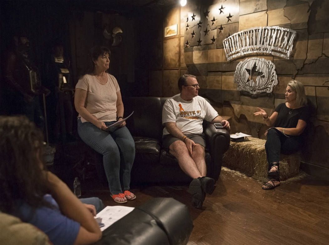Deb Dailey, second from left, president of the EMS Training Center of Southern Nevada, Chris Philippsen and Kristine Schalk discuss the steps of healing at a local Route 91 survivors support group ...