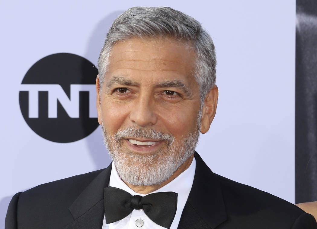 In this June 7, 2018, file photo, George Clooney arrives at the 46th AFI Life Achievement Award Honoring himself at the Dolby Theatre in Los Angeles. Clooney tops the 2018 Forbes' list of highest- ...