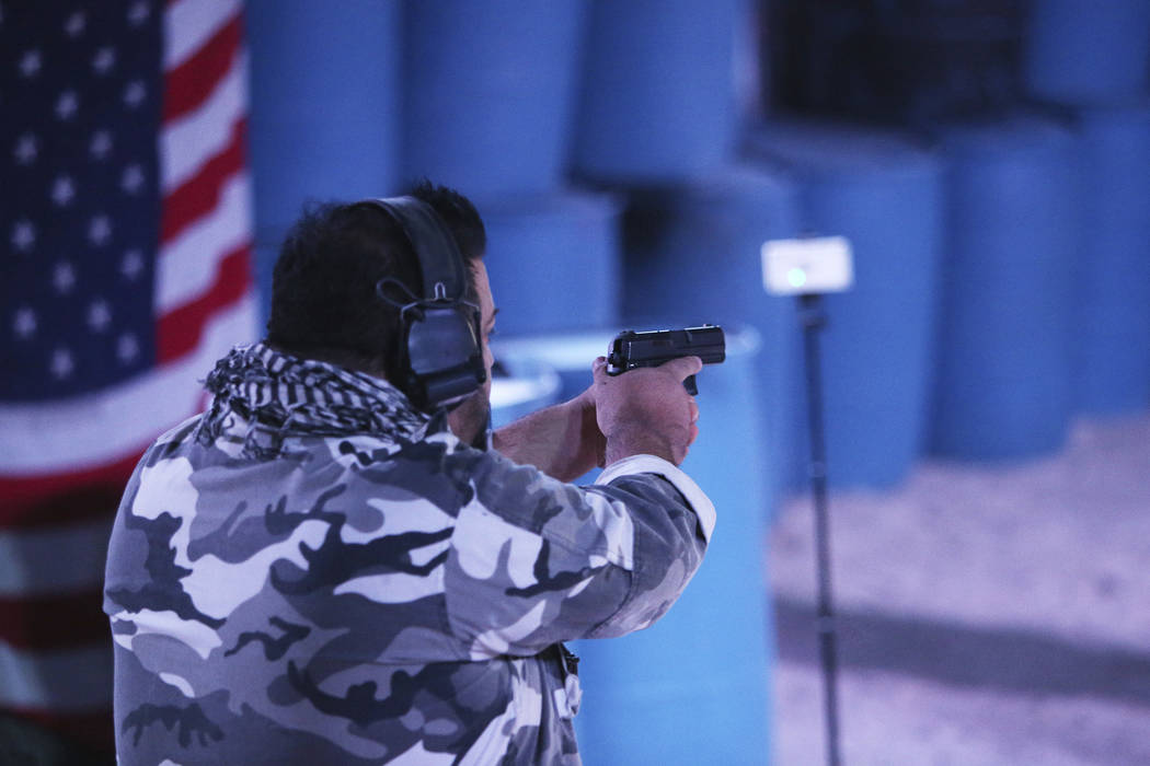 Nephi Oliva, owner of Las Vegas Gunfights, shoots a target to show how the FireFly indoor wireless gunshot sensor works at Las Vegas Gun Fights in Las Vegas, Monday, Sept. 24, 2018. The device is ...