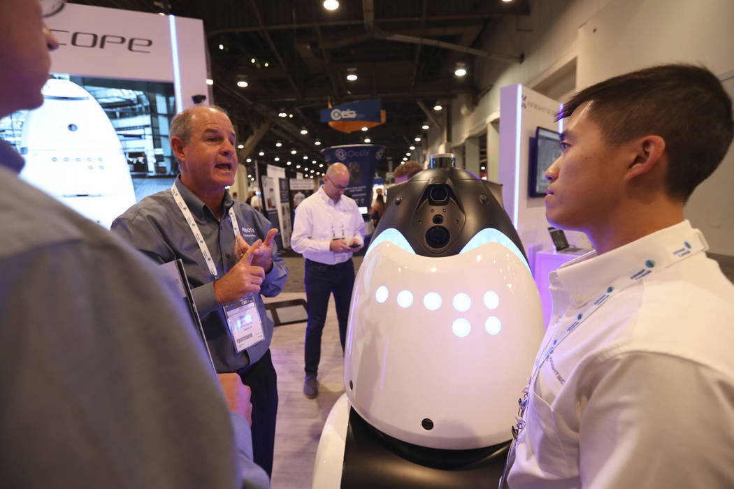 Knightscope employees explaining their robots to GSX attendees at the Las Vegas Convention Center on Wednesday, September 26, 2018. (Todd Prince/Las Vegas Review-Journal)