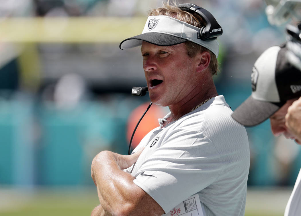 FILE - In this Sunday, Sept. 23, 2018, file photo, Oakland Raiders head coach Jon Gruden works the sideline during the first half of an NFL football game against the Miami Dolphins in Miami Garden ...