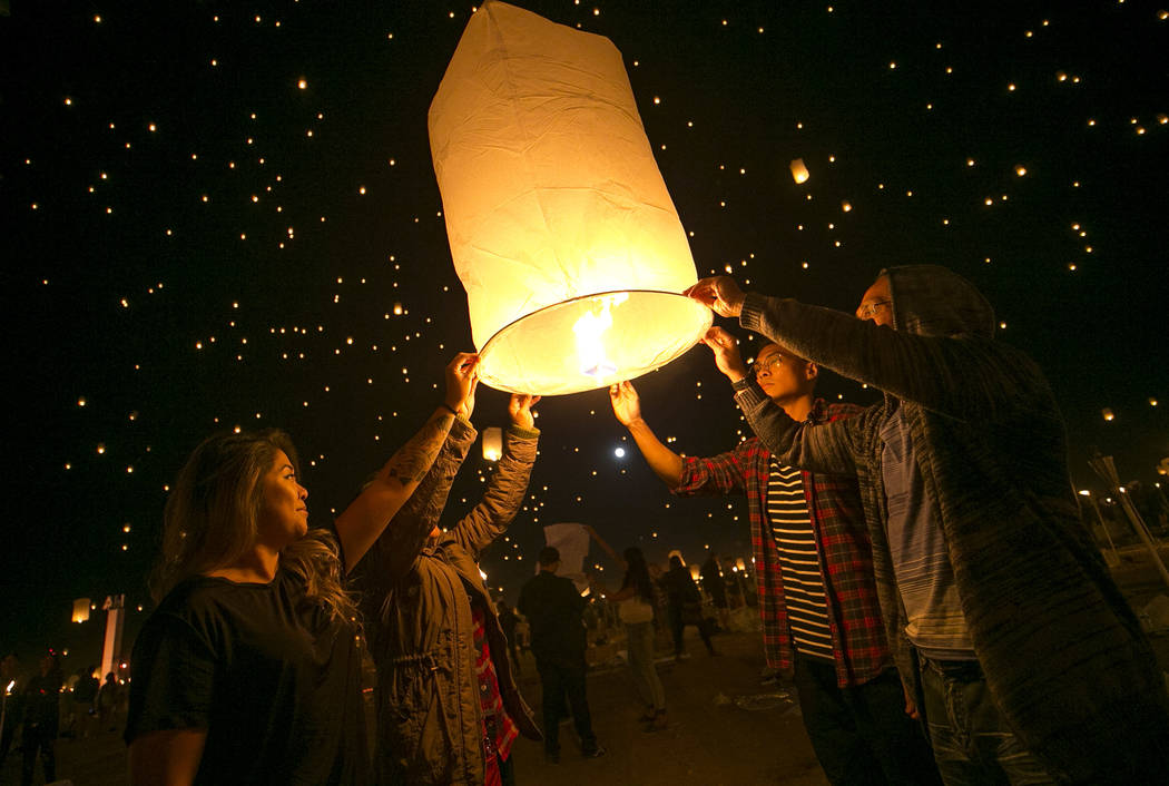 Participants prepare to release a lanterns during the RiSE Lantern Festival held at the Moapa River Indian Reservation on Friday, Oct. 6, 2017. Richard Brian Las Vegas Review-Journal @vegasphotograph