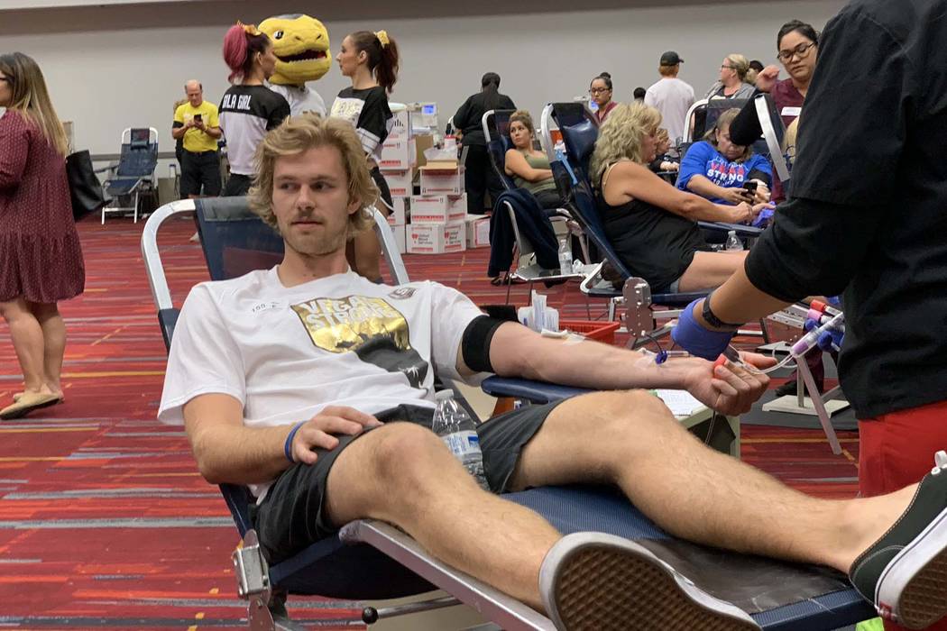 Jon Merrill, a member of the Vegas Golden Knights, donates blood during the Vitalent blood drive at the Las Vegas Convention Center on the one-year anniversary of the Las Vegas shooting, Oc.t 1, 2 ...