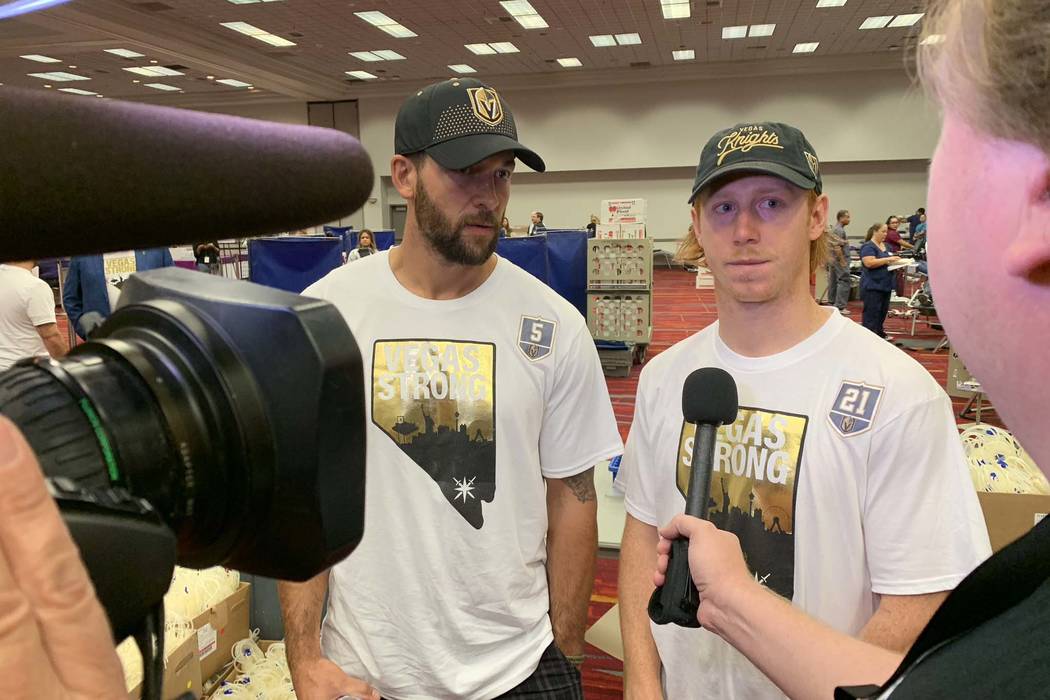 Deryk Engelland, left, and Cody Eakin of the Vegas Golden Knights arrive to take part in the Vitalent blood drive at the Las Vegas Convention Center on the one-year anniversary of the Las Vegas sh ...