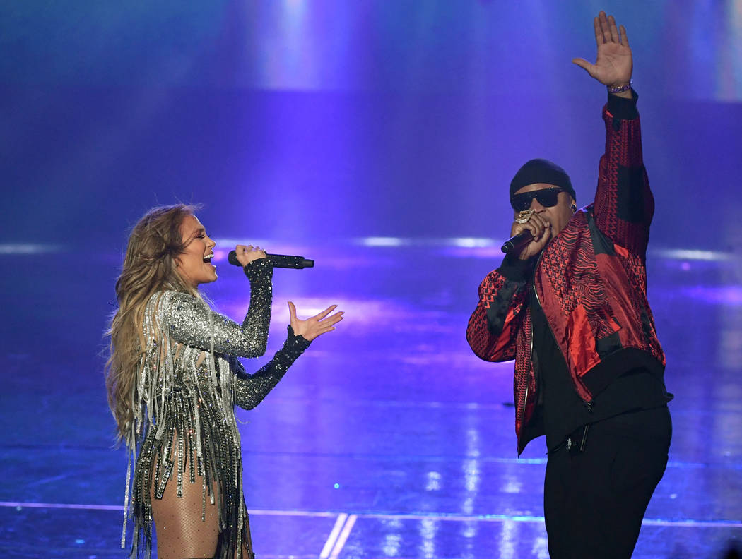 Jennifer Lopez and LL Cool J perform during the finale of her residency "Jennifer Lopez: All I Have" at Zappos Theater at Planet Hollywood on the Las Vegas Strip, Sept. 29, 2018. (Ethan Miller/Get ...