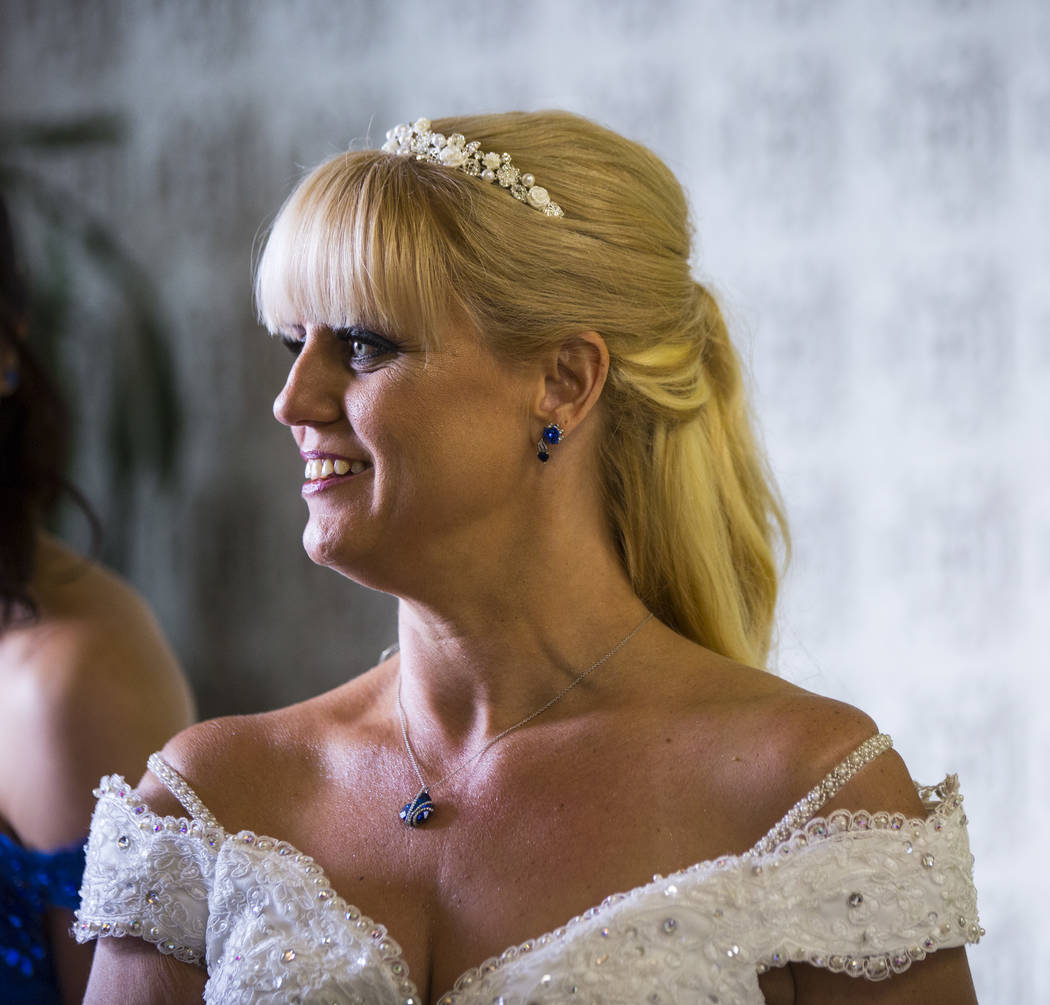 Oshia Collins-Waters looks on before the start of her wedding ceremony with Todd Wienke at Chapel of the Flowers in Las Vegas on Monday, Oct. 1, 2018. Todd was shot three times as he shielded Oshi ...