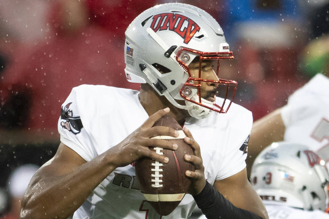 UNLV quarterback Armani Rogers (1) looks for a receiver during an NCAA college football game against Arkansas State on Saturday, Sept. 22, 2018, Jonesboro, Ark. (Jacob Wiegand/The Jonesboro Sun vi ...