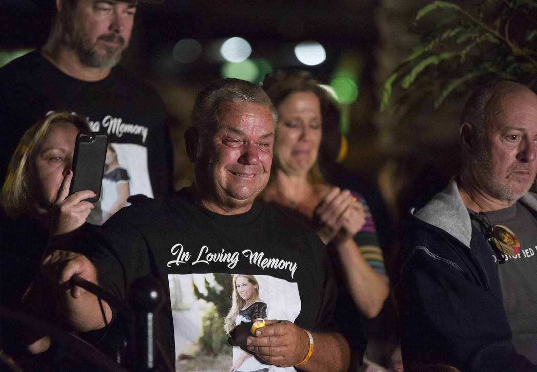 Family members of those killed in the Oct 1 shooting grieve while the names of their loved ones are read during a ceremony organized by the City of Las Vegas in conjunction with Get Outdoors Nevad ...