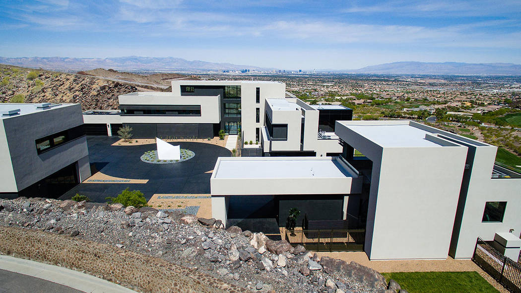 Three separate structures connected through a central circular drive. (Simply Vegas)