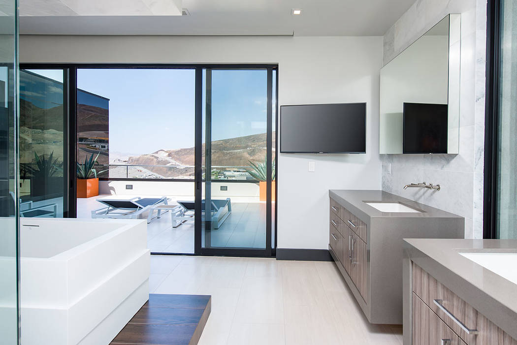 The homeowners are sports fans; and so TV screens can be found everywhere, even in the master bath. (Simply Vegas)