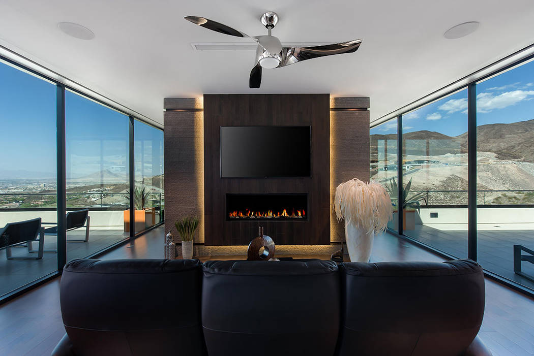 The master suite features a modern gas fireplace and sitting area. (Simply Vegas)