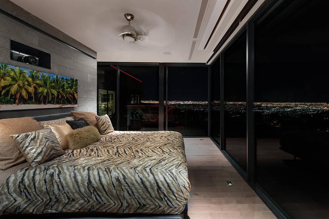 The master bedroom's floor-to-ceiling windows offer a sweeping view of the Las Vegas lights. (Simply Vegas)