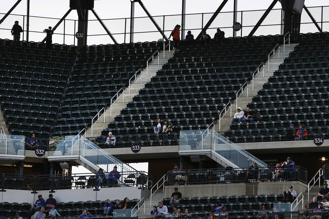 Empty seats are seen during a baseball game between the New York Mets and Miami Marlins at Citi Field, in New York on Sept. 30, 2018. Major League Baseball's attendance dropped to its lowest level ...