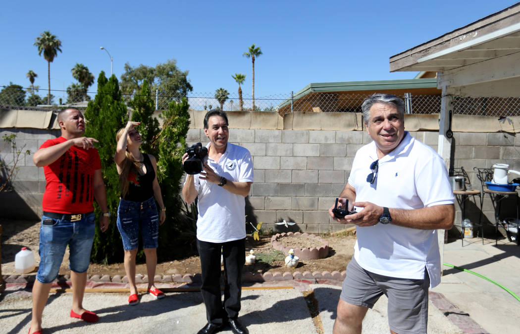 Rasiel Martinez, from left, his wife Olaidys Ramos, Oscar Ruiz and Vincent Valenzuela react to the arrival of a pigeon on the Cher Ami leg of the Racing Pigeon Cross Country Relay from Victorville ...