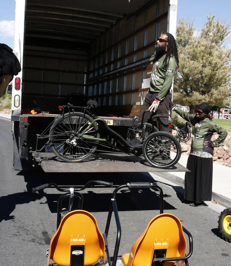 Retired U.S. Air Force Senior Airmen Kelley Guidry, right, and her husband Peter load a tricycle into a truck at Patriot Park on Monday, Oct. 8, 2018, in Las Vegas. The Kelley's formed the nonprof ...