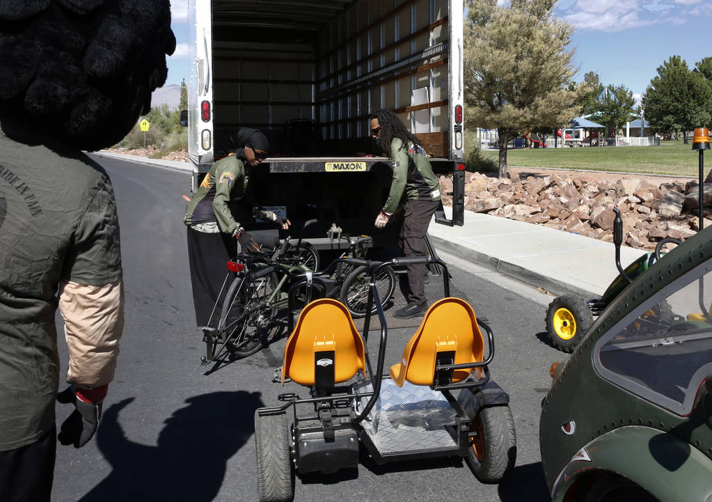 Retired U.S. Air Force Senior Airmen Kelley Guidry, right, and her husband Peter load a tricycle into a truck at Patriot Park on Monday, Oct. 8, 2018, in Las Vegas. The Kelley's formed the nonprof ...