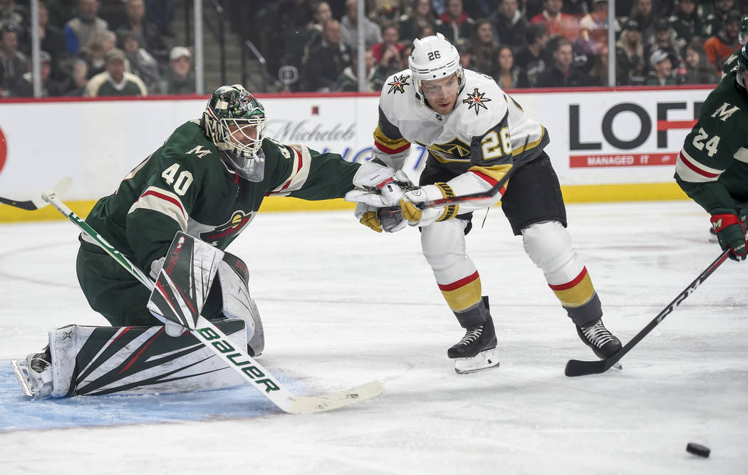 Minnesota Wild goalie Devan Dubnyk (40) pushes off Vegas Golden Knights forward Paul Stastny (26) in the first period during an NHL hockey game Saturday, Oct. 6, 2018, in St. Paul, Minn. (AP Photo ...
