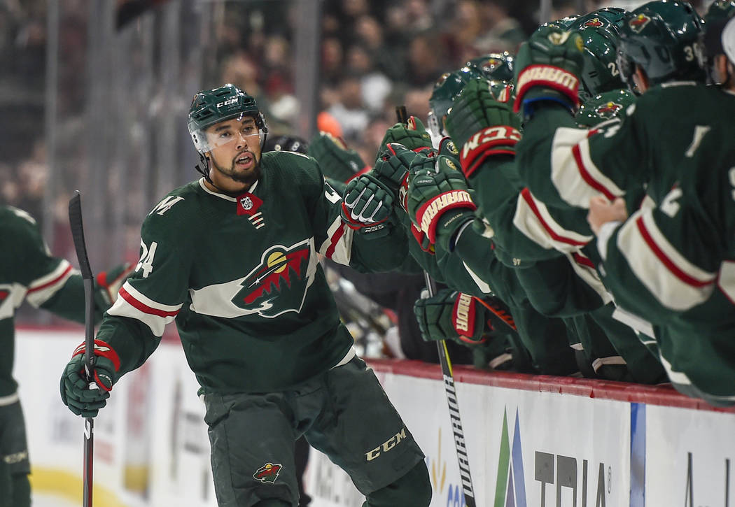 Minnesota Wild defenseman Mathew Dumba celebrates with the bench after scoring a goal against the Vegas Golden Knights in the first period during an NHL hockey game Saturday, Oct. 6, 2018, in St. ...