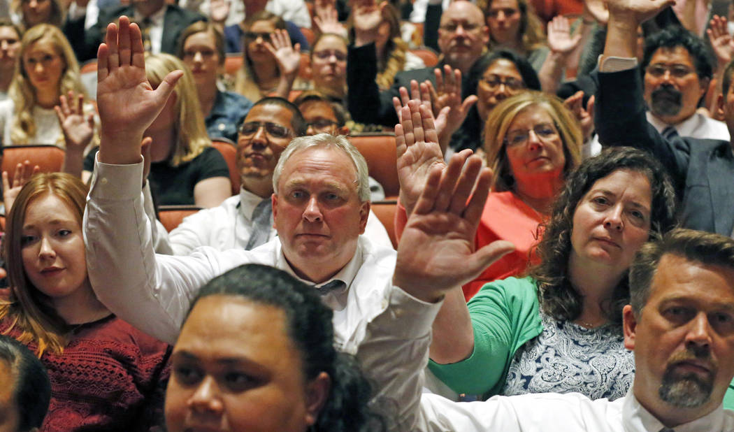 Mormons participate in a long-standing custom called a "sustaining" when Latter-day Saints stand and raise their hands during the twice-annual conference of The Church of Jesus Christ of ...