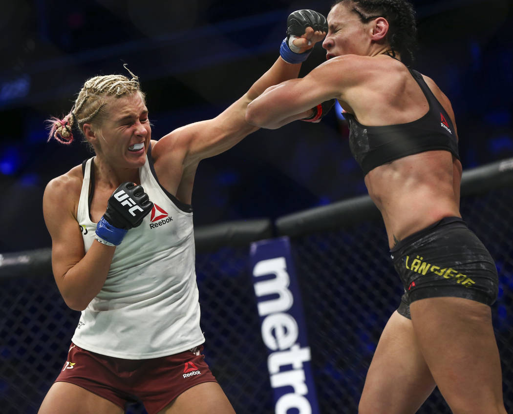 Lina Lansberg, right, takes a hit from Yana Kunitskaya during their bantamweight bout at UFC 229 at T-Mobile Arena in Las Vegas on Saturday, Oct. 6, 2018. Chase Stevens Las Vegas Review-Journal @c ...