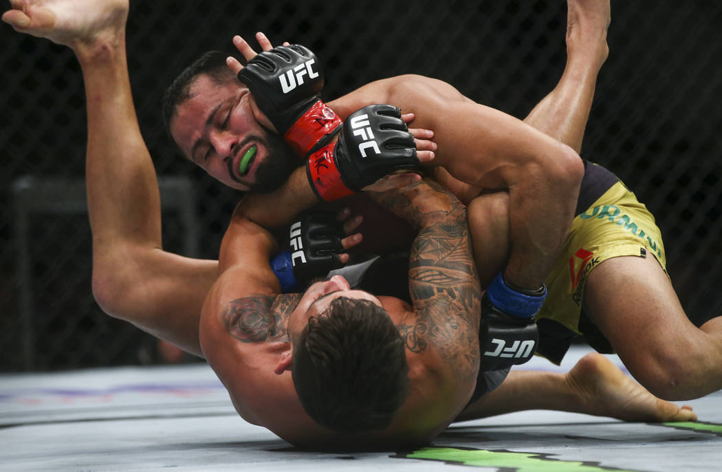 Jussier Formiga, above, fights Sergio Pettis during their flyweight bout at UFC 229 at T-Mobile Arena in Las Vegas on Saturday, Oct. 6, 2018. Chase Stevens Las Vegas Review-Journal @csstevensphoto