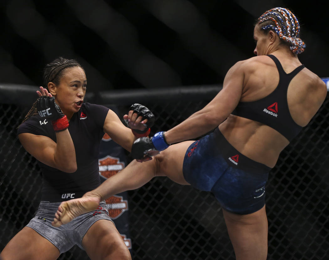 Michelle Waterson, left, fights Felice Herrig during their strawweight bout at UFC 229 at T-Mobile Arena in Las Vegas on Saturday, Oct. 6, 2018. Waterson won via unanimous decision. Chase Stevens ...