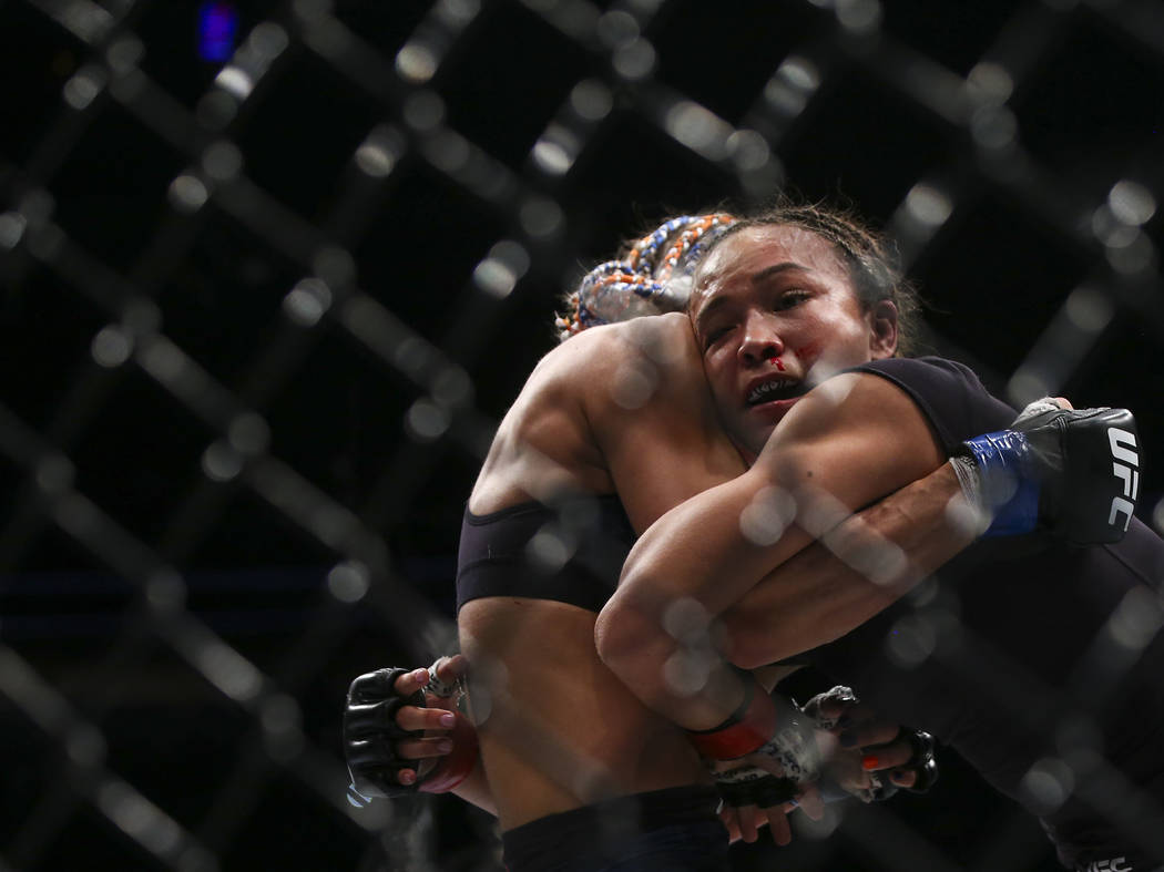 Michelle Waterson, right, fights Felice Herrig during their strawweight bout at UFC 229 at T-Mobile Arena in Las Vegas on Saturday, Oct. 6, 2018. Waterson won via unanimous decision. Chase Stevens ...