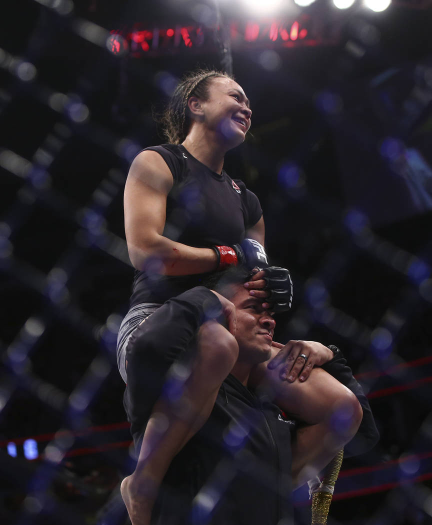 Michelle Waterson celebrates her unanimous decision victory over Felice Herrig in their strawweight bout at UFC 229 at T-Mobile Arena in Las Vegas on Saturday, Oct. 6, 2018. Chase Stevens Las Vega ...
