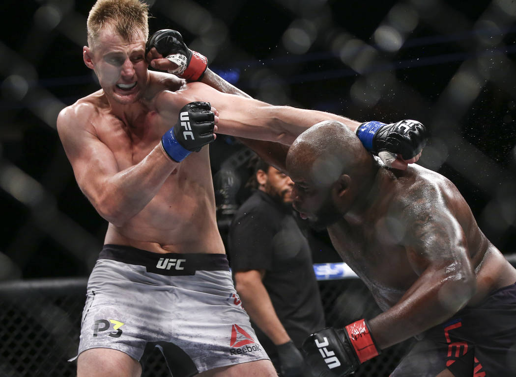 Derrick Lewis, right, lands a hit against Alexander Volkov during their heavyweight bout at UFC 229 at T-Mobile Arena in Las Vegas on Saturday, Oct. 6, 2018. Chase Stevens Las Vegas Review-Journal ...