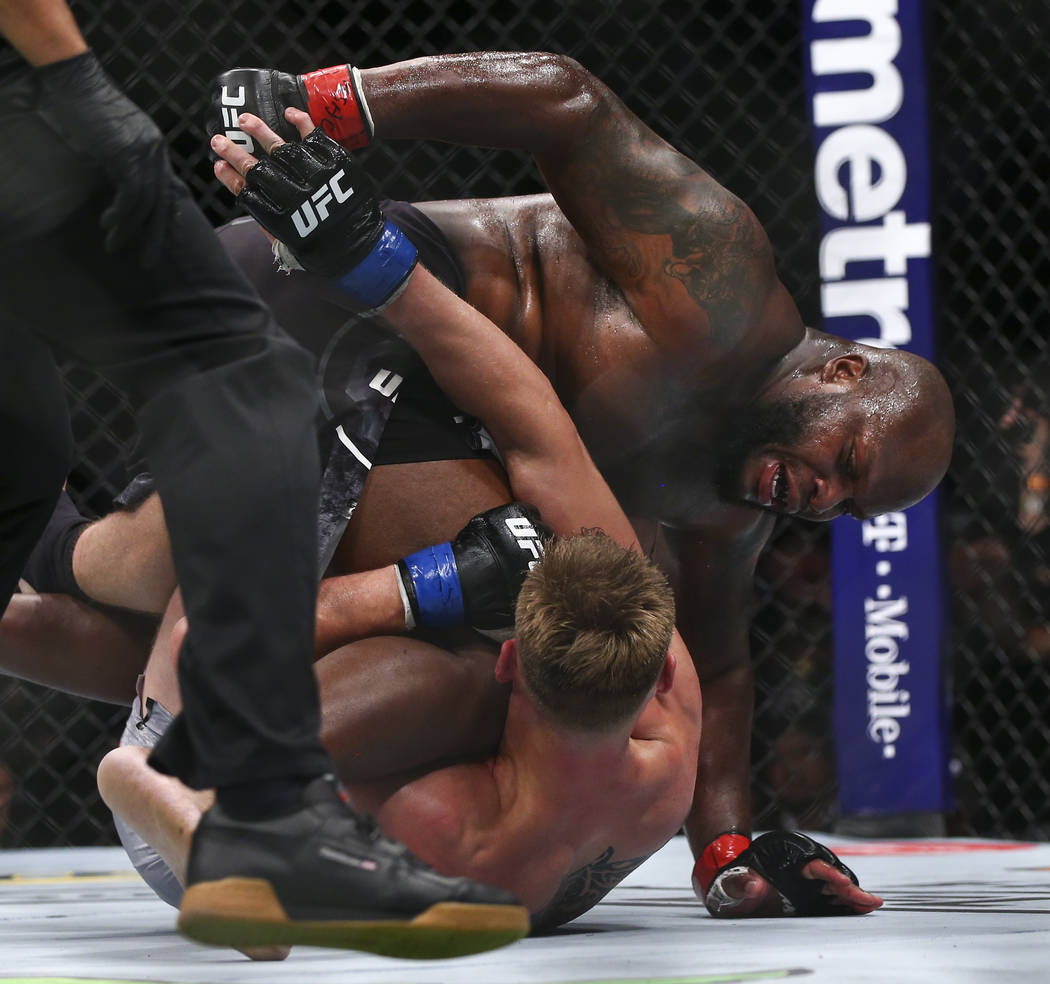 Derrick Lewis, above, delivers a flurry of blows on the way to his knockout win over Alexander Volkov in their heavyweight bout at UFC 229 at T-Mobile Arena in Las Vegas on Saturday, Oct. 6, 2018. ...