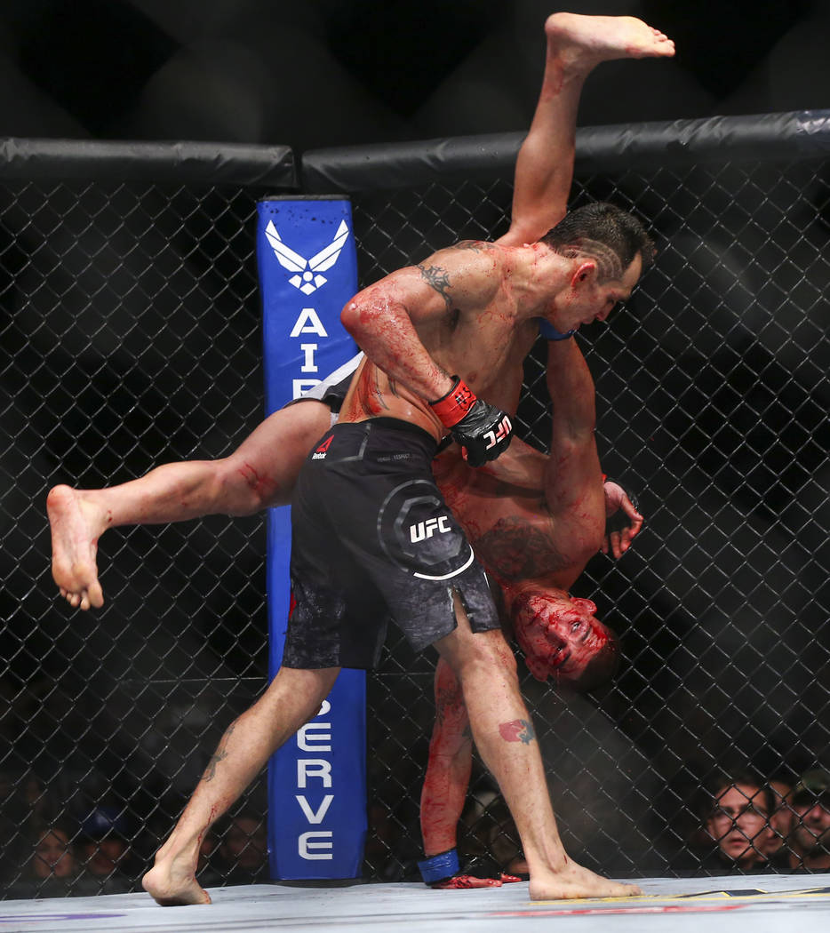 Tony Ferguson, left, fights Anthony Pettis during their lightweight bout at UFC 229 at T-Mobile Arena in Las Vegas on Saturday, Oct. 6, 2018. Chase Stevens Las Vegas Review-Journal @csstevensphoto