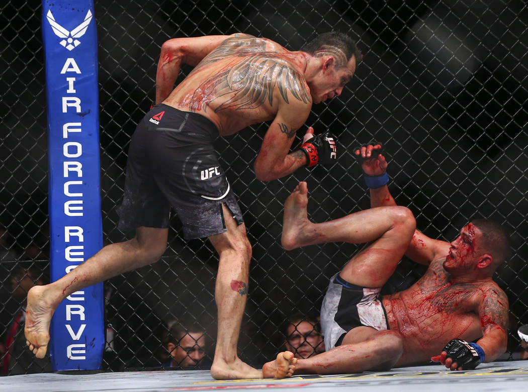 Tony Ferguson, left, fights Anthony Pettis during their lightweight bout at UFC 229 at T-Mobile Arena in Las Vegas on Saturday, Oct. 6, 2018. Chase Stevens Las Vegas Review-Journal @csstevensphoto