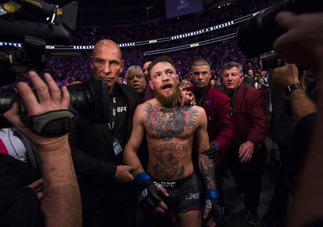 Conor McGregor leaves the octagon after his loss to Khabib Nurmagomedov in their lightweight title bout at UFC 229 at T-Mobile Arena in Las Vegas on Saturday, Oct. 6, 2018. Chase Stevens Las Vegas ...