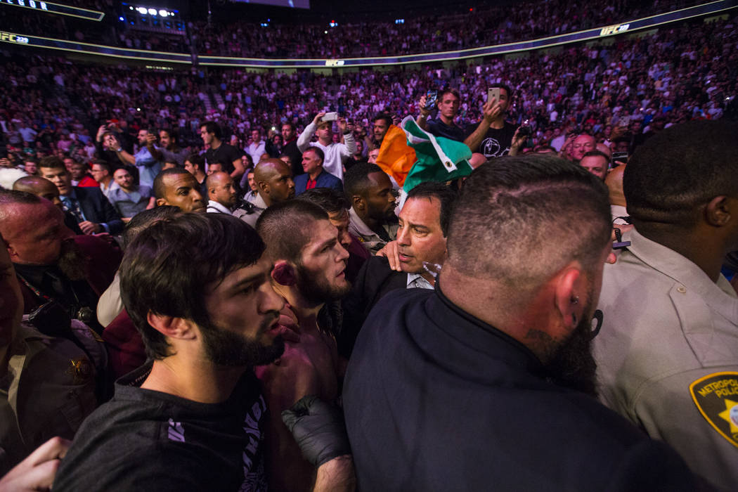 Khabib Nurmagomedov leaves the octagon after his win over Conor McGregor in their lightweight title bout at UFC 229 at T-Mobile Arena in Las Vegas on Saturday, Oct. 6, 2018. Chase Stevens Las Vega ...