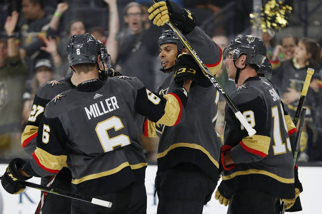 Vegas Golden Knights right wing Ryan Reaves, center, celebrates after scoring against the Los Angeles Kings during the second period of a preseason NHL hockey game Friday, Sept. 28, 2018, in Las V ...