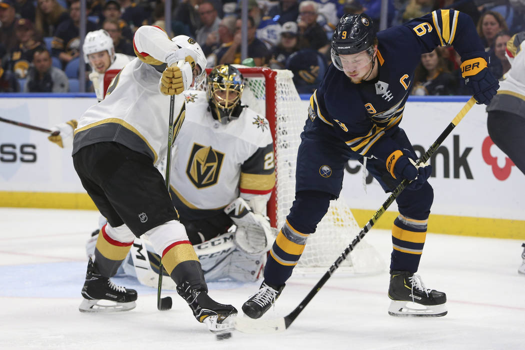 Buffalo Sabres forward Jack Eichel (15) passes the puck in front of Vegas Golden Knights goalie Marc-Andre Fleury (29) during the third period of an NHL hockey game, Monday, Oct. 8, 2018, in Buffa ...