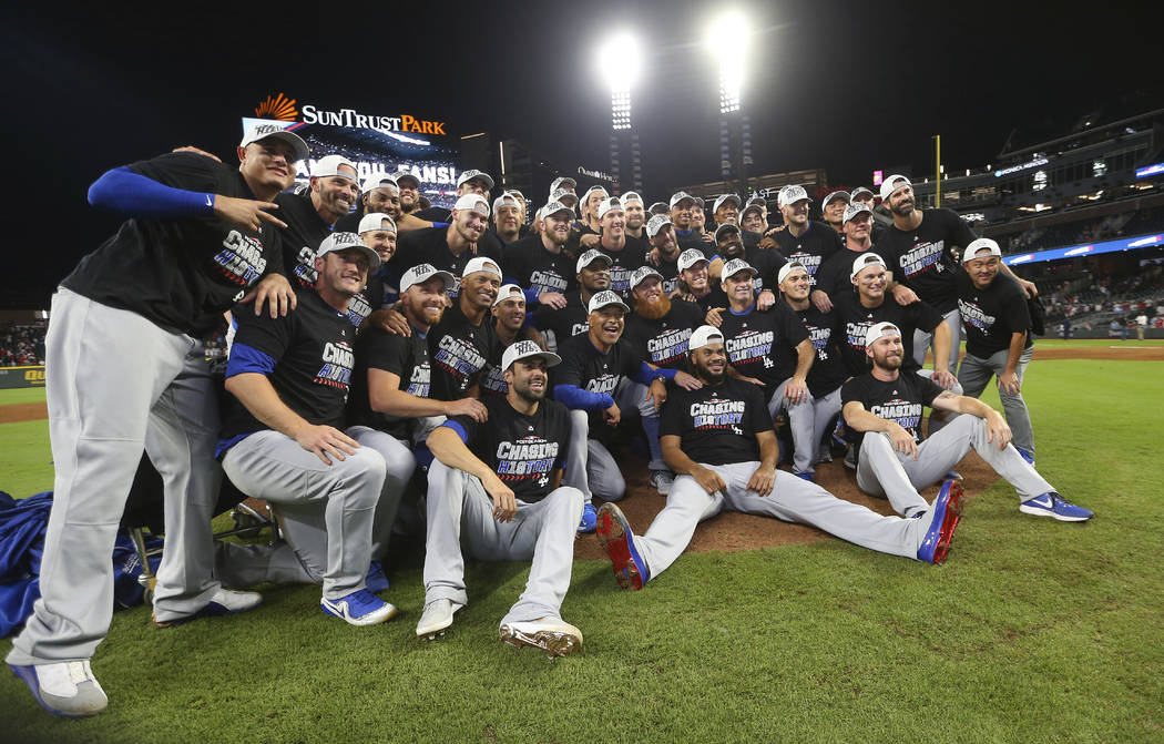 The Los Angeles Dodgers pose for a group portrait after an Game 4 of  baseball's National League Division Series against the Atlanta Braves,  Monday, Oct. 8, 2018, in Atlanta. The Los Angeles