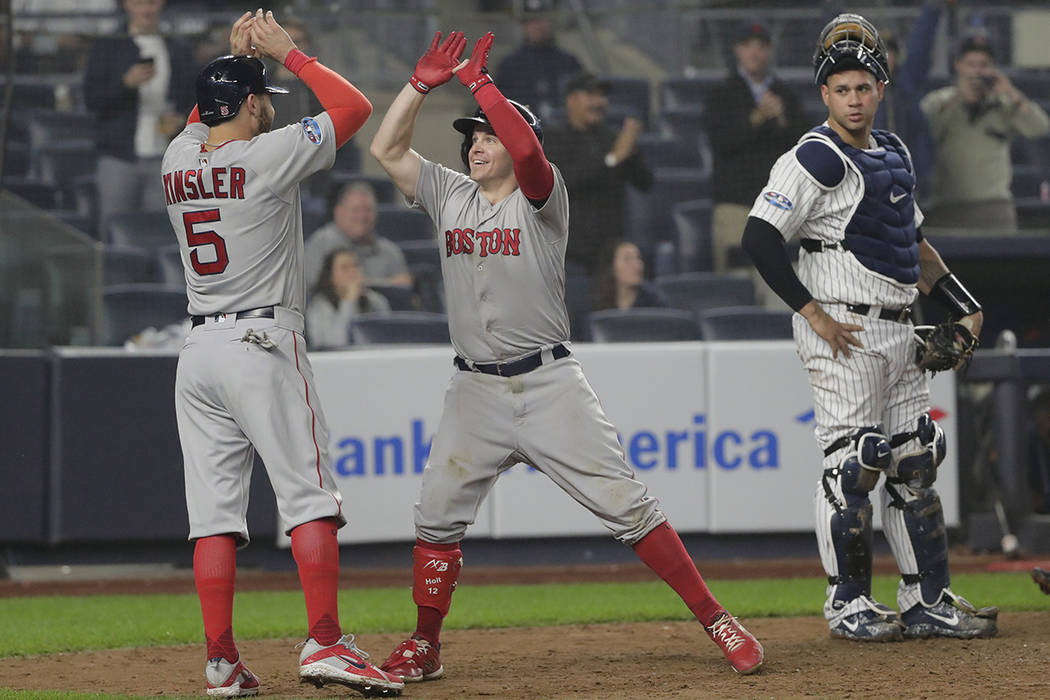 Boston Red Sox's Brock Holt reacts after hitting a double during