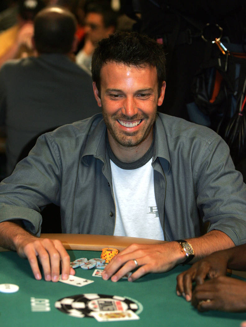 Actor Ben Affleck smiles after getting crushed on a hand of poker during the inaugural Ante Up For Africa Poker Tournament made up of celebrities and poker professionals at the World Series