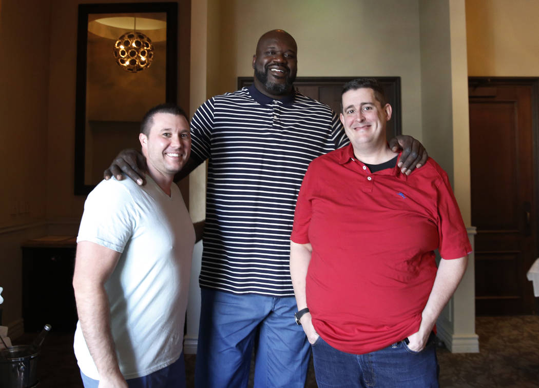 Former NBA player and owner of "Big Chicken" restaurant Shaquille O'Neil, center, poses for photo with his chefs and partners Matt Piekarski, left, and Matt Silverman on Thursday, Oct. 1 ...
