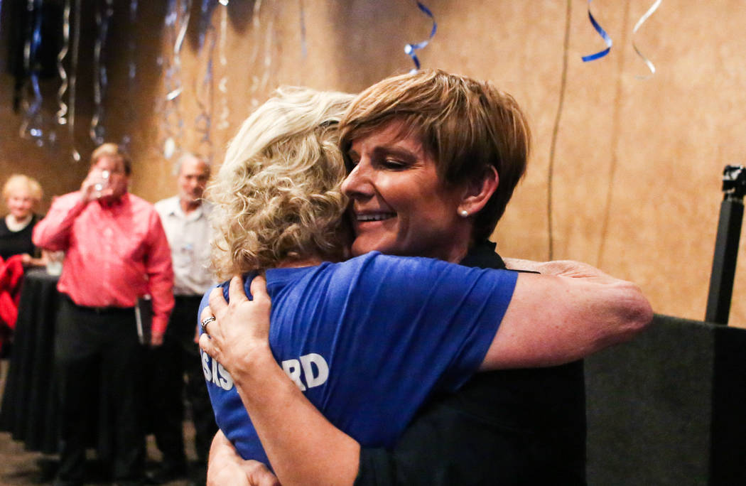 Democratic Congressional District 4 candidate Susie Lee gets consoled by her friend after losing primary elections during her election watch party at Saffron Flavors of India in Las Vegas Tuesday ...