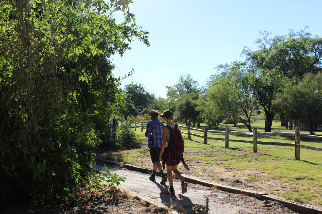 Visitors walk by the fruit orchard at Corn Creek at Desert National Wildlife Refuge. (Deborah Wall/Las Vegas Review-Journal)