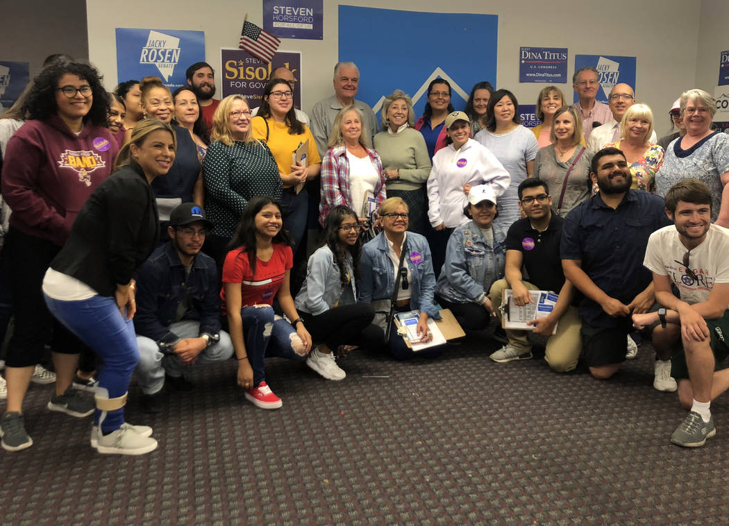 Nevada Democratic party campaign volunteers pose for a photo with DNC chairman Tom Perez and vice chair Grace Meng, Democratic gubernatorial candidate Steve Sisolak and Rep. Dina Titus at a canvas ...