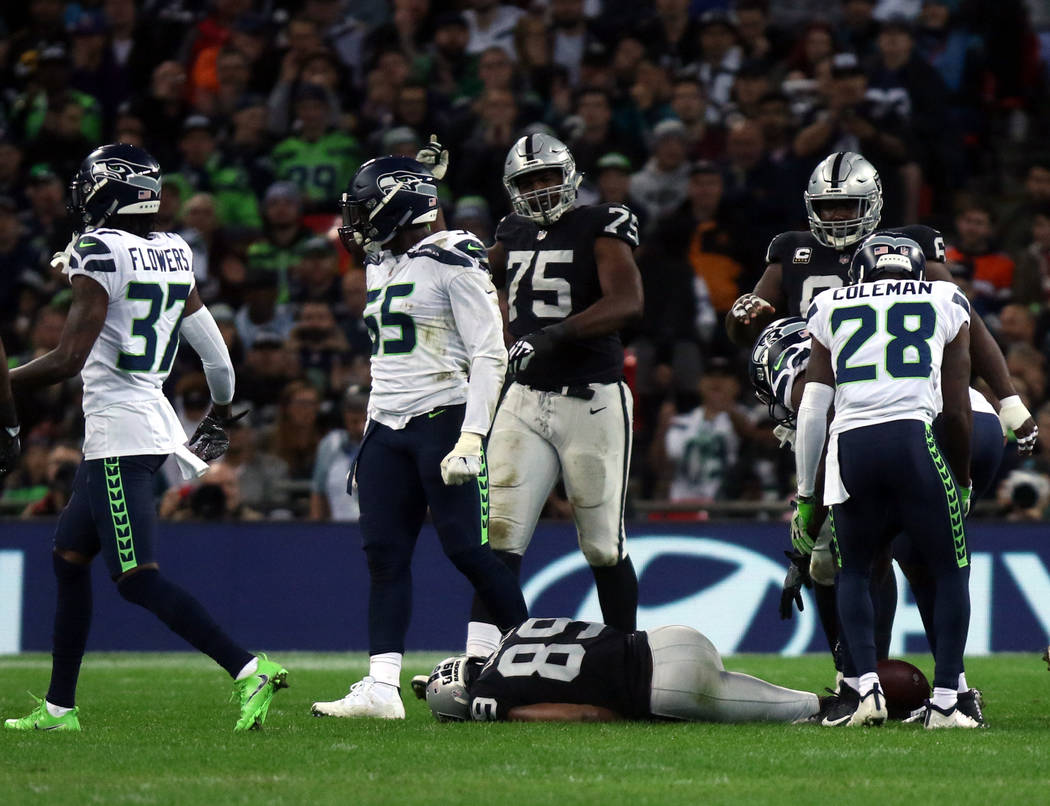 Oakland Raiders wide receiver Amari Cooper (89) lays on the field unconscious after getting hit by Seattle Seahawks strong safety Bradley McDougald (30), not pictured, during the first half of an ...